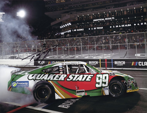 This autographed 2024 Daniel Suarez #99 Quaker State Racing Los Angeles Race Win photo captures the thrilling burnout after his victory. Signed by Suarez, it’s a unique piece of NASCAR history with Certificate of Authenticity, perfect for collectors.