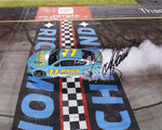 Capture the excitement of Denny Hamlin's victory at Richmond with this autographed photo showcasing the #11 Mavis Racing car in a thrilling victory burnout. This signed 8x10 inch glossy print is a must-have collectible for any dedicated NASCAR fan, complete with a Certificate of Authenticity.