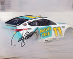 This autographed 2024 Denny Hamlin #11 Mavis Tire Racing Dover Win photo captures the electrifying moment of his burnout celebration. Measuring 8x10 inches and signed, it comes with a Certificate of Authenticity, making it a fantastic gift for any NASCAR lover or memorabilia collector.
