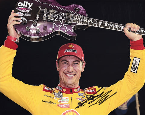 Autographed 8x10 glossy photo of Joey Logano celebrating in Victory Lane with the iconic guitar after his 2024 Nashville NASCAR win. The photo includes his signature and a Certificate of Authenticity, making it an amazing collectible for NASCAR fans.