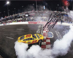 8x10 autographed photo of Joey Logano celebrating his 2024 North Wilkesboro win with an iconic burnout. The glossy photo comes with a Certificate of Authenticity and lifetime guarantee, making it an ideal collectible for racing enthusiasts.