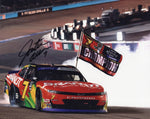 Autographed NASCAR photo of Justin Allgaier’s #7 Brandt Racing car at Phoenix, commemorating his 2024 XFINITY Series Championship win. A vibrant, glossy collectible with COA.