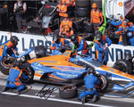 Experience the excitement of the 2024 INDY 500 Double with this signed 8x10 photo capturing Kyle Larson in action during a critical pit stop. This unique image showcases the teamwork behind his #17 Hendrick Motorsports car.