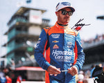 This autographed glossy photo of Kyle Larson captures the energy of the 2024 INDY 500 on pit road. Each signed collectible includes a COA, making it an exceptional gift for racing enthusiasts and a standout in any collection.
