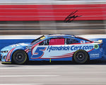 Signed 2024 Kyle Larson #5 Hendrick Cars Racing Charlotte Roval Race photo featuring the pink window net. This 8x10 glossy photo is autographed by Larson and includes a COA, making it a perfect collectible.