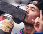 Signed 2024 Kyle Larson Brickyard 400 victory photo. This 8x10 inch glossy photo features Larson celebrating his win with a kiss on the iconic IMS trophy, and includes COA for guaranteed authenticity.
