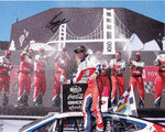 Capture the exhilarating moment of Kyle Larson celebrating his 2024 Sonoma Win with this autographed glossy photo. Featuring Larson joyfully spraying champagne in Victory Lane, this signed collectible is a must-have for any NASCAR enthusiast.
