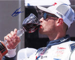 Commemorate the excitement of victory with this autographed Kyle Larson photo from his 2024 Sonoma Win. Displaying Larson toasting with wine in Victory Lane, this signed collectible is perfect for any NASCAR fan, adding a touch of racing glory to your memorabilia.