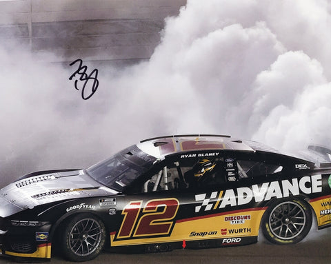 Autographed 2024 Ryan Blaney #12 Advance Racing Iowa Race Win 8x10 photo capturing his iconic victory burnout. Signed by Blaney and comes with a Certificate of Authenticity (COA), perfect for collectors and NASCAR fans.