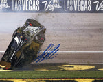 Autographed 2024 Tyler Reddick #45 Jordan Brand Black Toyota photo of the Las Vegas car flip, signed by Reddick and accompanied by a Certificate of Authenticity (COA).