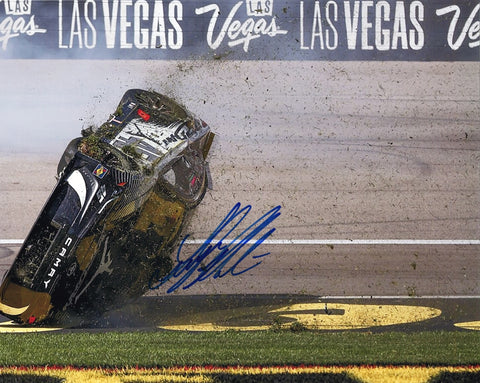 Autographed 2024 Tyler Reddick #45 Jordan Brand Black Toyota photo of the Las Vegas car flip, signed by Reddick and accompanied by a Certificate of Authenticity (COA).
