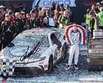 Authentic signed 8x10 photo of Tyler Reddick celebrating his 2024 Talladega victory with his team in victory lane, featuring the #45 Jordan Jumpman car. Comes with Certificate of Authenticity (COA).