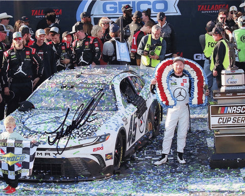 Authentic signed 8x10 photo of Tyler Reddick celebrating his 2024 Talladega victory with his team in victory lane, featuring the #45 Jordan Jumpman car. Comes with Certificate of Authenticity (COA).