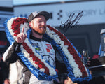 Signed 8x10 photo of Tyler Reddick’s 2024 Talladega win, featuring his #45 Jumpman Racing car in victory lane with the 23XI Racing team celebrating. Includes COA and lifetime authenticity guarantee.