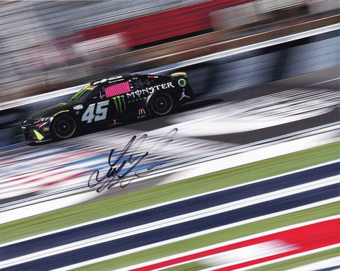 Signed 2024 Tyler Reddick #45 Monster Toyota photo from the Charlotte Roval race, featuring Reddick in action on the track. Signed by Tyler Reddick with a Certificate of Authenticity (COA) for authenticity.