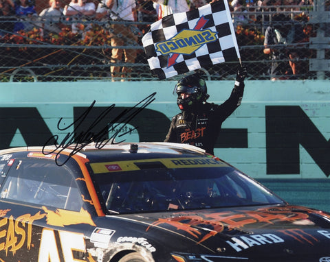 Autographed 2024 8x10 glossy photo of Tyler Reddick’s #45 The Beast Hard Monster car crossing the checkered flag at Homestead. A perfect NASCAR collectible and display piece. Includes COA. We are always here to help with any questions about this great gift for racing fans.