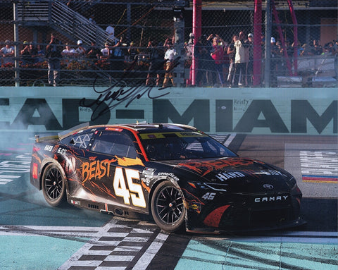 Exclusive 8x10 inch glossy photo of Tyler Reddick’s #45 The Beast Racing celebrating his 2024 Homestead Playoff win with a victory burnout. Signed by Reddick, complete with COA for guaranteed authenticity.