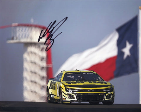 William Byron’s 2024 COTA Race win is commemorated in this autographed 8x10 photo featuring the Texas flag. It’s a must-have for any NASCAR fan and comes with COA.