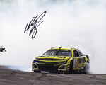 A signed 8x10 photo of William Byron’s 2024 COTA race win burnout. This NASCAR collectible includes a COA and is a perfect gift for racing fans.