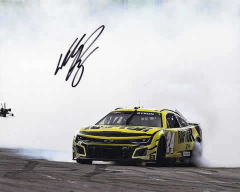 A signed 8x10 photo of William Byron’s 2024 COTA race win burnout. This NASCAR collectible includes a COA and is a perfect gift for racing fans.