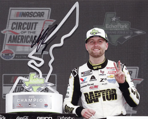 This autographed 8x10 photo features William Byron holding the trophy after his 2024 COTA race win. Signed and authenticated with COA. Perfect NASCAR collectible.