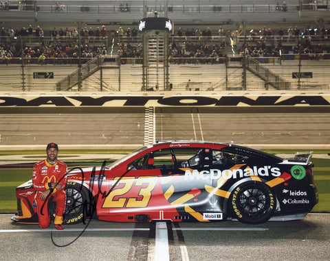 Autographed 2025 NASCAR photo of Bubba Wallace’s 23XI Racing McDonald’s Toyota car in action at Daytona. A collectible item with rich detail and a COA for authenticity.