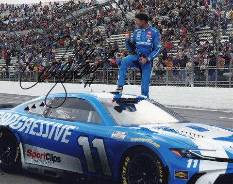 Autographed 2025 Denny Hamlin photo showing his victory celebration after winning at Martinsville Speedway in the #11 Progressive Racing car. A meaningful gift with COA included.
