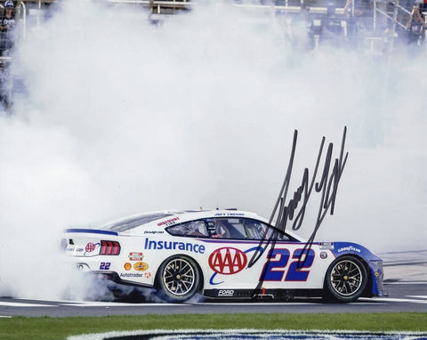 Autographed 2025 Joey Logano #22 AAA Racing Texas Race Win 8x10 NASCAR photo featuring his victory burnout moment. Signed glossy picture with COA, perfect for collectors and fans.