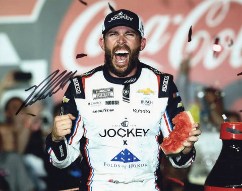 Signed 8x10 glossy photo of Ross Chastain celebrating his 2025 Coca-Cola 600 win in the #1 Jockey Patriotic Salutes Watermelon Smash car. A prized NASCAR collectible for enthusiasts and collectors.