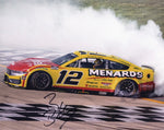 Autographed 8x10 glossy photo of Ryan Blaney celebrating his 2025 Nashville Cracker Barrel win with a victory burnout in the #12 Menards Racing car, ideal for NASCAR fans and collectors.
