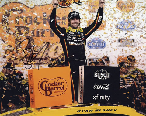 Signed 8x10 glossy photo of Ryan Blaney celebrating his 2025 Nashville Cracker Barrel win holding a victory lane guitar, showcasing the #12 Menards Racing car. Ideal for NASCAR fans and collectors.