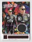 The autographed Alex Bowman 2024 Donruss Racing SUITED UP card featuring race-worn firesuit memorabilia. This limited edition #84/99 card includes Bowman’s signature, making it a rare and valuable NASCAR collectible.