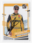 The signed Christopher Bell 2024 Donruss Racing card, highlighting his bold signature and the vibrant #20 DeWalt Team artwork, ideal for racing fans.