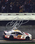 Autographed 8x10 glossy photo of Dale Earnhardt Jr. in the #88 National Guard Racing car celebrating his checkered flag win at Daytona 500. A prized NASCAR collectible with COA, ideal for fans and collectors.