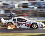 Signed 1995 Mark Martin Rolex 24 Hours photo, featuring the #6 Nobody's Fool Racing GTS-1 Roush Ford Mustang. Includes Certificate of Authenticity for guaranteed signature authenticity.
