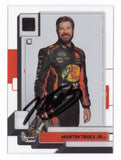 The autographed Martin Truex Jr. 2023 Panini Chronicles Clearly Donruss card, featuring a vibrant design and Truex's signature, showcasing his iconic #19 car.