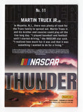 Detailed image of the autographed Martin Truex Jr. 2023 Panini Chronicles Racing Thunder card, highlighting the #19 car and signature with vibrant colors.