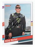 This autographed Riley Herbst 2024 Donruss Racing 1991 Retro Xfinity Series card features the iconic design of the 1991 series. With Riley's signature, it’s a rare collectible with a Certificate of Authenticity, perfect for NASCAR fans.