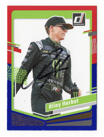 The Riley Herbst 2024 Donruss Racing Red & Blue Parallel Insert signed card is a rare NASCAR collectible featuring the driver’s authentic signature and stunning design. This limited-edition piece is perfect for any fan or collector.
