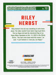 Enhance your NASCAR collection with this autographed Riley Herbst 2024 Donruss Racing Red & Blue Parallel card. With only a limited number available, this card features an eye-catching design and comes with a Certificate of Authenticity.