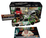 Autographed 2008 Kyle Busch #18 M&M's Indiana Jones Darlington 1/24 scale NASCAR diecast featuring an authentic signature, limited edition number #1968 of only 1,980 produced, a Certificate of Authenticity, and a photo of Kyle signing the car at M&M's World in Las Vegas.