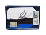Displayed autographed Ryan Newman #12 Alltel Racing race-used NASCAR sheet metal with three-color graphics and visible track wear. Sized roughly like a standard trading card, the piece comes in a plastic toploader and makes a great gift for NASCAR fans and memorabilia collectors.