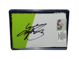 Autographed 2019 Kyle Busch #18 M&M’s Halloween Racing Martinsville race-used NASCAR composite sheet metal featuring authentic race wear, colorful graphics, and included COA. Roughly trading card sized and protected inside a plastic toploader for display and collectible preservation purposes.