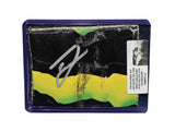 Autographed 2022 Ty Gibbs #54 He Gets Us race-used composite NASCAR sheet metal from his Portland Joe Gibbs Racing Toyota. This signed collectible is roughly the size of a standard trading card, fits inside a plastic toploader for protection and display, and includes a certificate of authenticity.