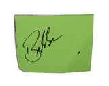 Autographed 2023 Bubba Wallace #23 DraftKings Racing green race-used composite NASCAR sheet metal from the Crayon 301 at Loudon. This signed collectible is roughly the size of a standard trading card, fits inside a plastic toploader for protection and display, and includes a certificate of authenticity.