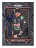 Brad Keselowski is featured on this autographed 2023 Panini Prizm Racing NASCAR trading card showcasing the distinctive Prizm design. Signed by the 2012 NASCAR Cup Series champion and RFK Racing No. 6 Ford driver and co-owner, this collectible includes a Certificate of Authenticity and celebrates his championship racing career.