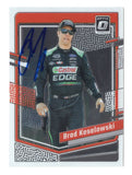 Brad Keselowski is featured on this autographed 2024 Donruss Optic Racing NASCAR trading card showcasing the distinctive Optic design. Signed by the 2012 NASCAR Cup Series champion and RFK Racing No. 6 Ford driver and co-owner, this collectible includes a Certificate of Authenticity and celebrates his championship racing career.