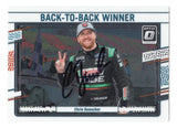 Chris Buescher's consecutive 2023 NASCAR Cup Series victories are celebrated on this autographed 2024 Donruss Optic Racing Back-To-Back Winner trading card. Featuring distinctive Optic styling and Buescher's signature, this collectible includes a Certificate of Authenticity and honors the RFK Racing No. 17 Ford driver.
