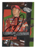 Autographed Dale Earnhardt Jr. 2004 Press Pass Trackside Racing Runnin N Gunnin NASCAR trading card featuring the distinctive insert design and the iconic No. 8 Budweiser Chevrolet driver. This signed vintage racing collectible includes a Certificate of Authenticity and celebrates Earnhardt Jr.'s memorable 2004 Daytona 500 winning season.