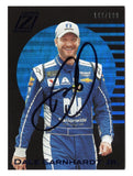 Autographed Dale Earnhardt Jr. 2021 Panini Chronicles Racing Zenith Blue NASCAR trading card featuring the distinctive Zenith insert design and eye-catching blue parallel styling. Individually serial numbered #166/199, this signed collectible includes a Certificate of Authenticity and celebrates the legendary two-time Daytona 500 champion and longtime NASCAR fan favorite.
